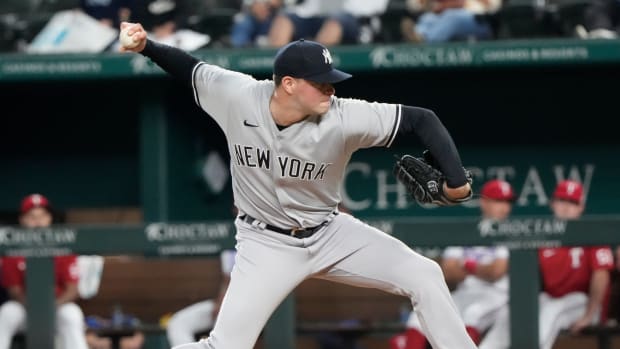 Oct 3, 2022; Arlington, Texas, USA; New York Yankees relief pitcher Scott Effross (59) delivers a pitch to the Texas Rangers during the ninth inning at Globe Life Field. The Yankees won 3-1.